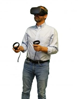 VR for Diversity Training - image of a person using a VR headset and hand controllers